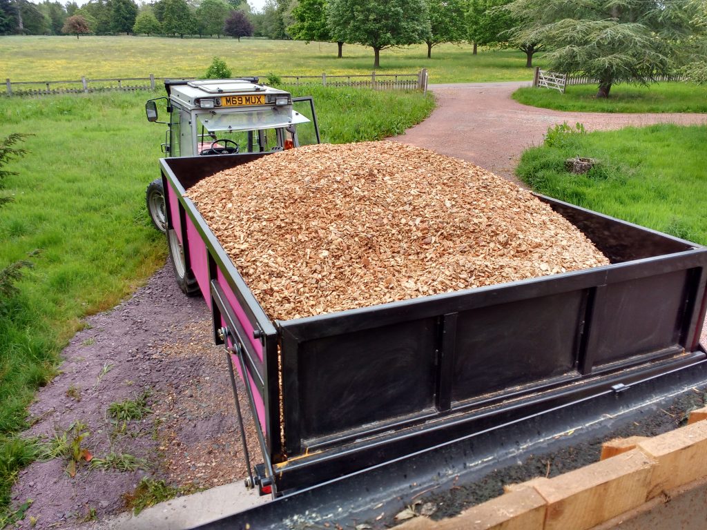Agricultural tractor trailer wood chips