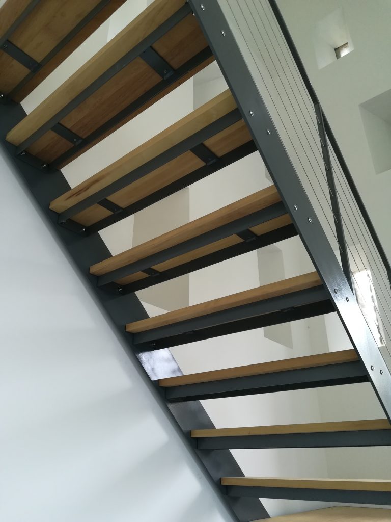 Wood and metal staircase wire handrail