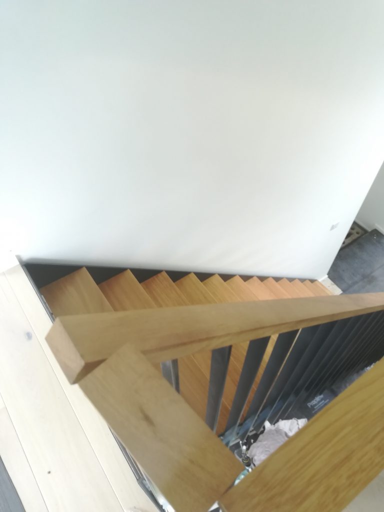 Wooden railings metal staircase